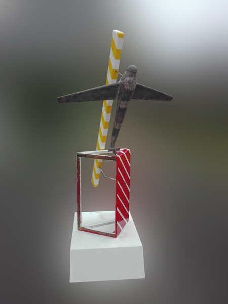 A sculpture with an up side down airplane with striped elements.